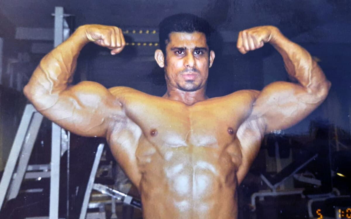 Shoaib Raza, Mr. Pakistan bodybuilding champion and founder of GymFinity, in a front double biceps pose