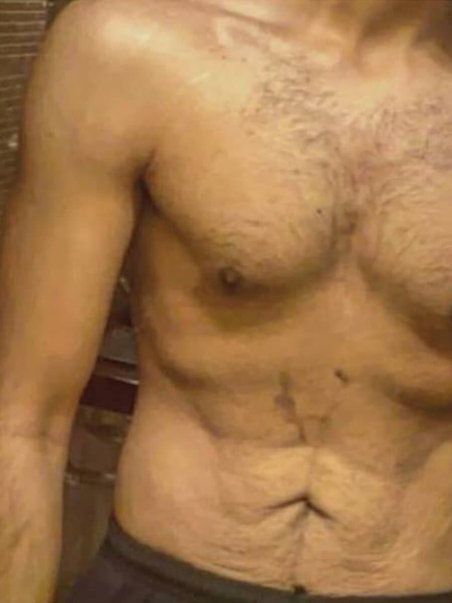 The same GymFinity online coaching client after fat loss, with visible abs